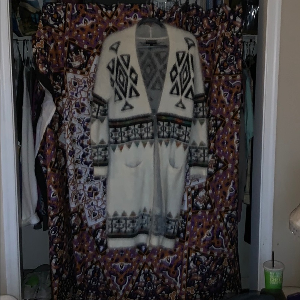 Long sleeved ankle length cardigan/sweater.